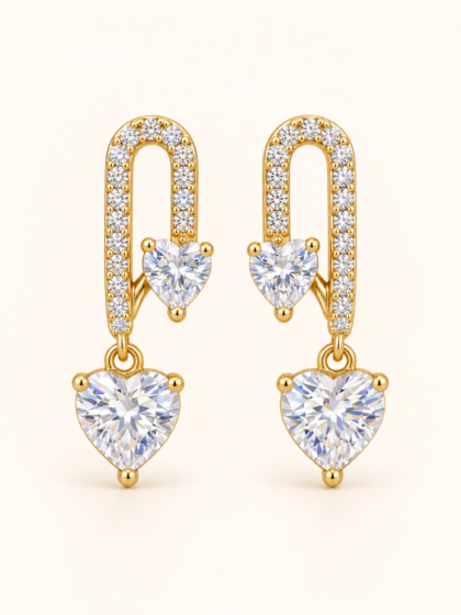 Gold-tone heart drop earrings with sparkling clear stones, featuring a crystal-studded U-shaped design and two heart-shaped gems.