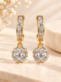 Gold-tone crystal drop hoop earrings with floral-style pendant .